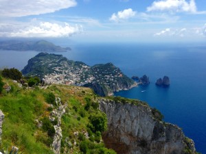 Isle of Capri - A view from the top of M. Solaro over the Faraglioni rocks to the Amalfi Coast beyond.